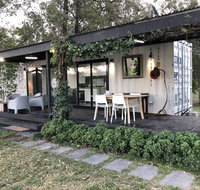 Absolute riverfront shipping container cabin - Airlie Beach Holiday